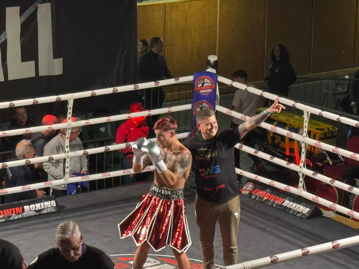 Boxer celebrating victory at Goodwin Boxing event
