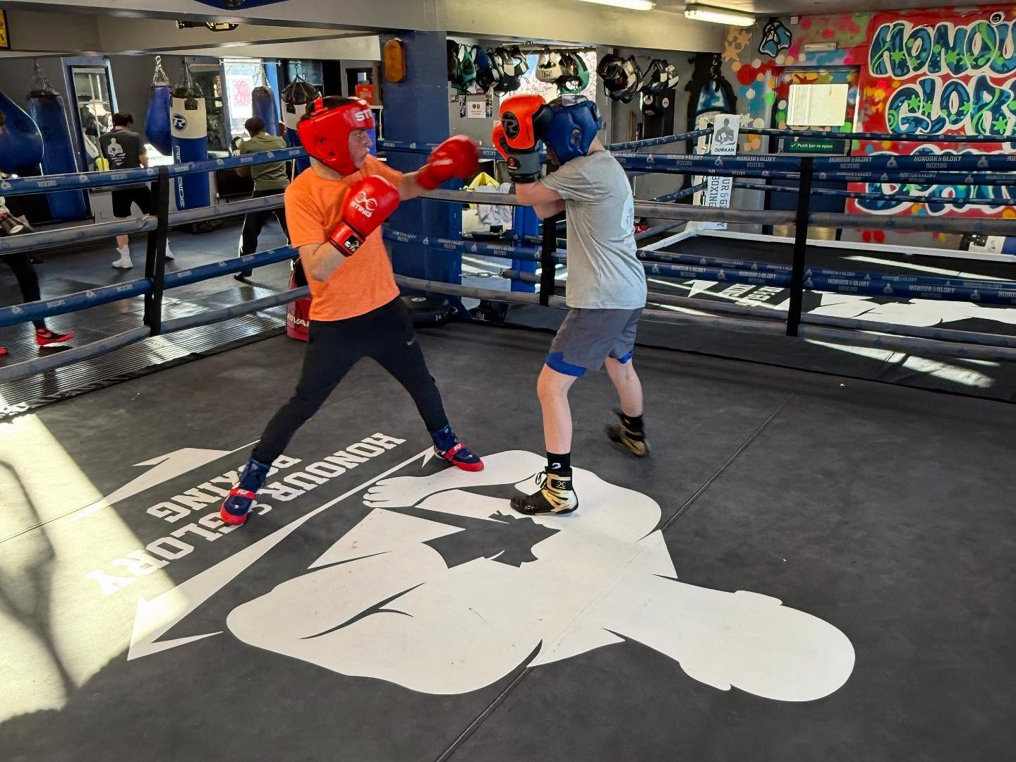 Two boxers sparring in the ring at Honour & Glory